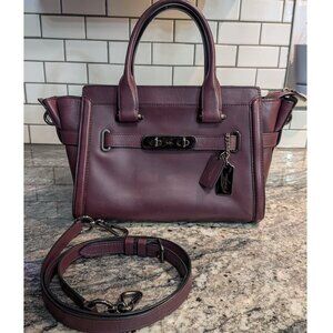 Coach Swagger 27 in oxblood color with gunmetal hardware